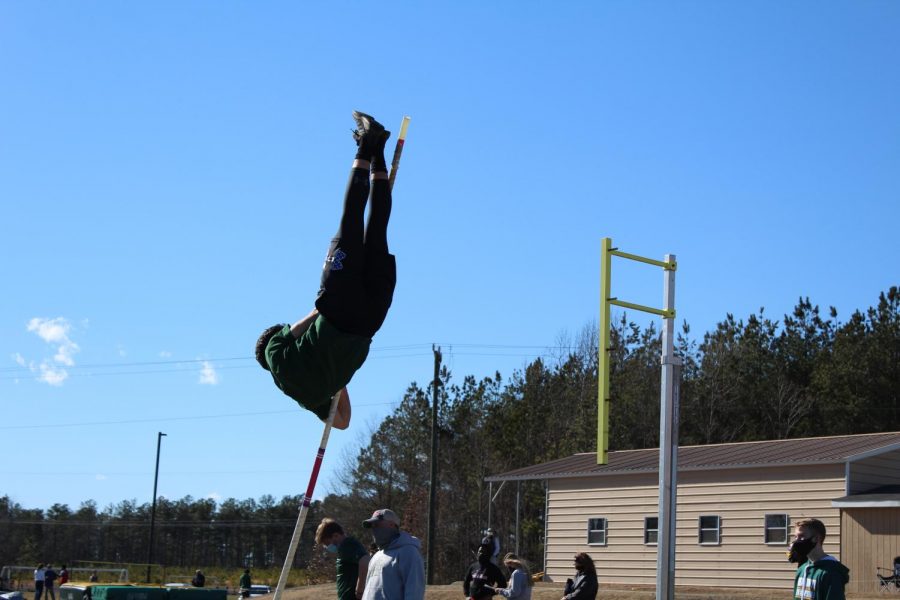 Junior Lucas Cash competing in Pole Vault during regionals.