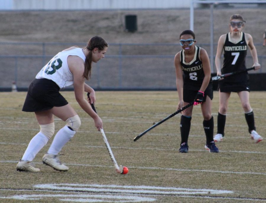 Junior Lydia Gillespie dodges Monticello opponents March 9.