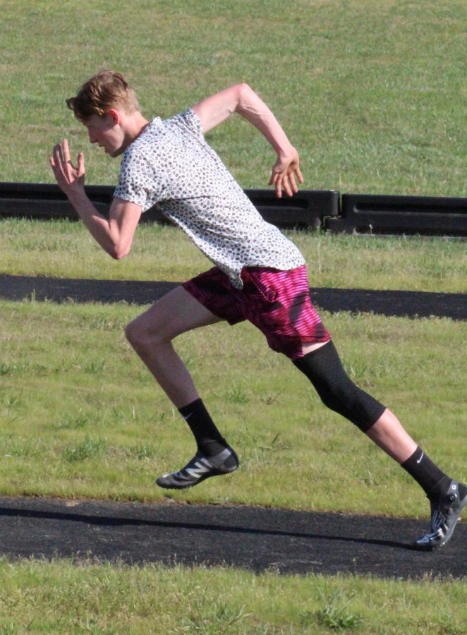 Sophomore Wyatt Snyder sprints his way down the track.