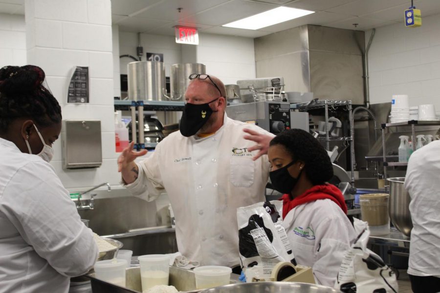 Chef Howell and his students preparing food during Culinary Class.