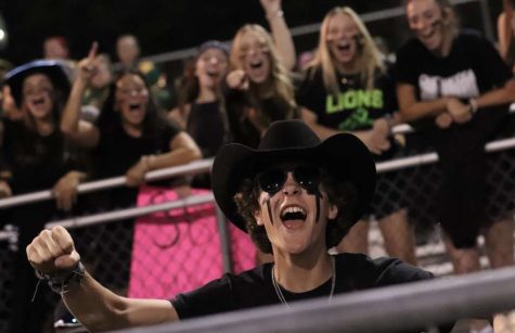 Photo courtesy of Andrew Woolfolk featuring Head Loonie, Cullen Hamel cheering on the varsity football team during the black out game as they won against  Massaponax, 30-22.