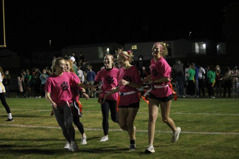 Former Seniors Kylie Robinson, Madison Middlesworth, Emma Mcgehee, Kendall Hyer, and Emion Byers celebrate after a play against the sophomores. 