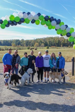 Photo courtesy of SPARC 5Ks Facebook featuring the runners/walkers of the 2019 5K with their pets at the finish line. 