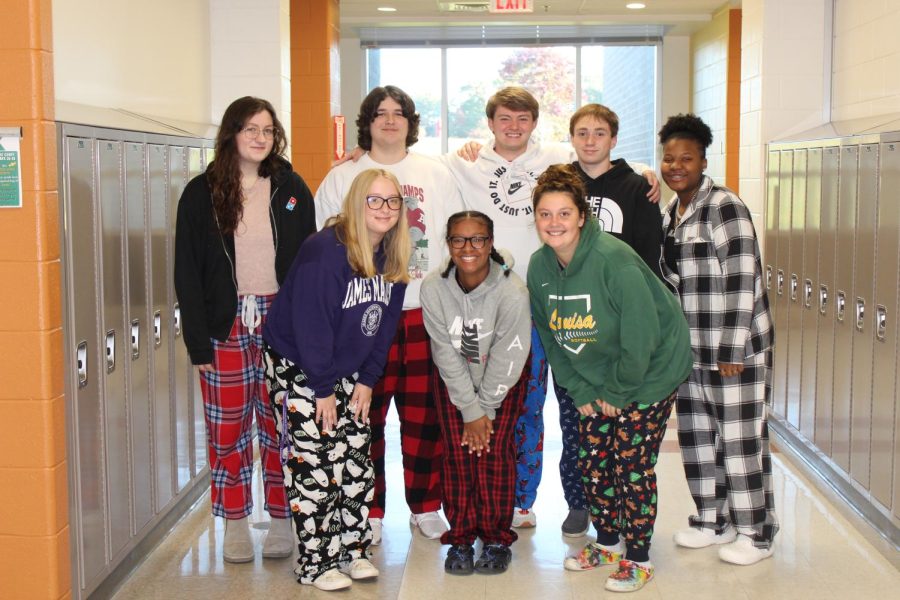 Madelyn Meadows, Aaliyah Barbour, Haley Walker, Sofia Ratcliff, Brady Hopkins, Davis Pruden, Colin King and Makiah Holcomb posing in their pajamas for spirit week. 
