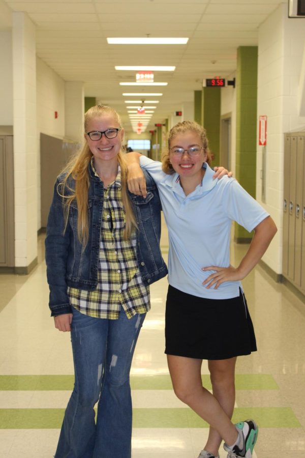 Abby Eyler and Abbi Creel posing for the country vs country club spirit day. 

