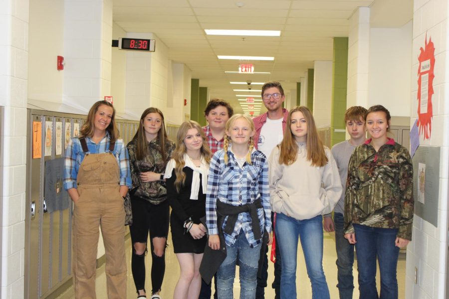 Mrs. Kazio and Mr. Varner posing for the country vs country club spirit day with their students Bailey Harris, Ethan Helfrich, Emily Harlow, Jeffrey Allison, Jasmine Silgevinck, Addison Alexander and Kalen Amedee.