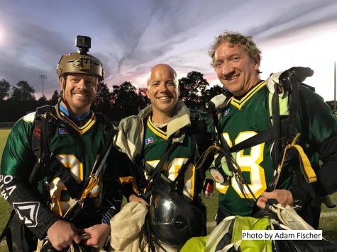 LC skydivers bringing in the game ball.