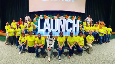 Louisa County teachers pose around the LAUNCH sign. 