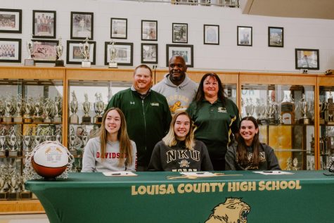 Sylvie Jackson, Emily Gillespie, and Dara Sharpe with their coaches and Athletic Director. 