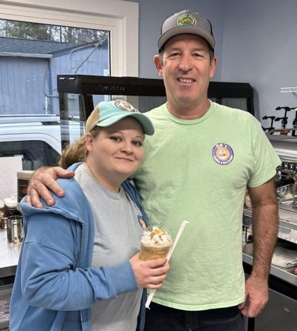 DK’s Coffee and Ice cream owner Darrin Welch poses during the morning rush with Ashley, one of his employees. 