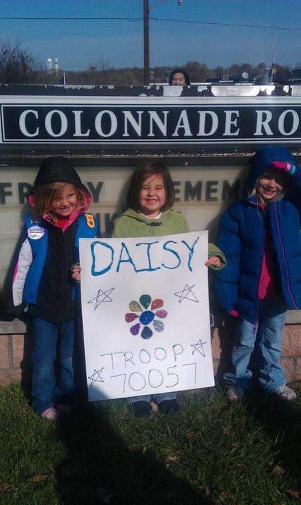 Ashley+N.%2C+Casey+Little%2C+and+Porschia+M.+holding+a+troop+sign+for+the+Veterans+Day+Parade.+
