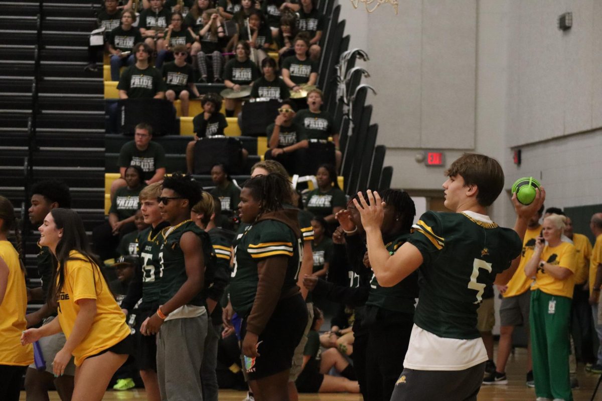 Quarterback Caleb Brady showing off his arm during a pep-rally game of dizzy football