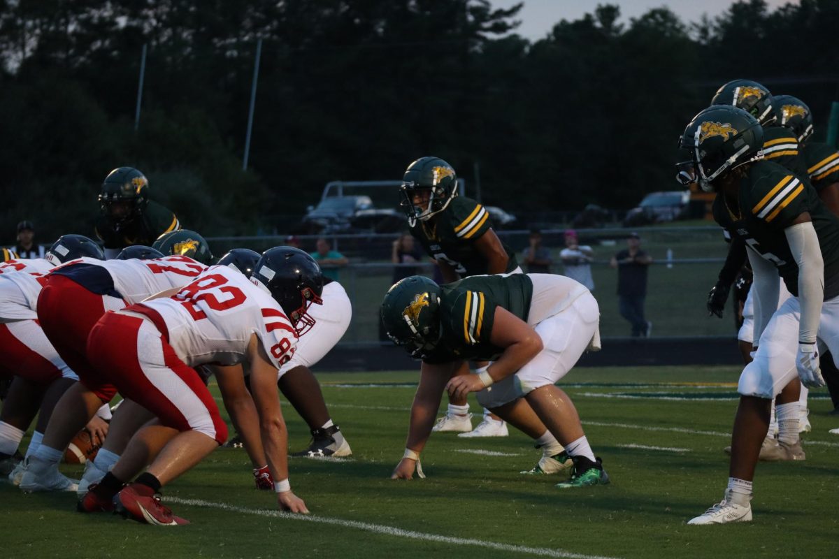 Louisa players set up to play offense, and work to get a touchdown.