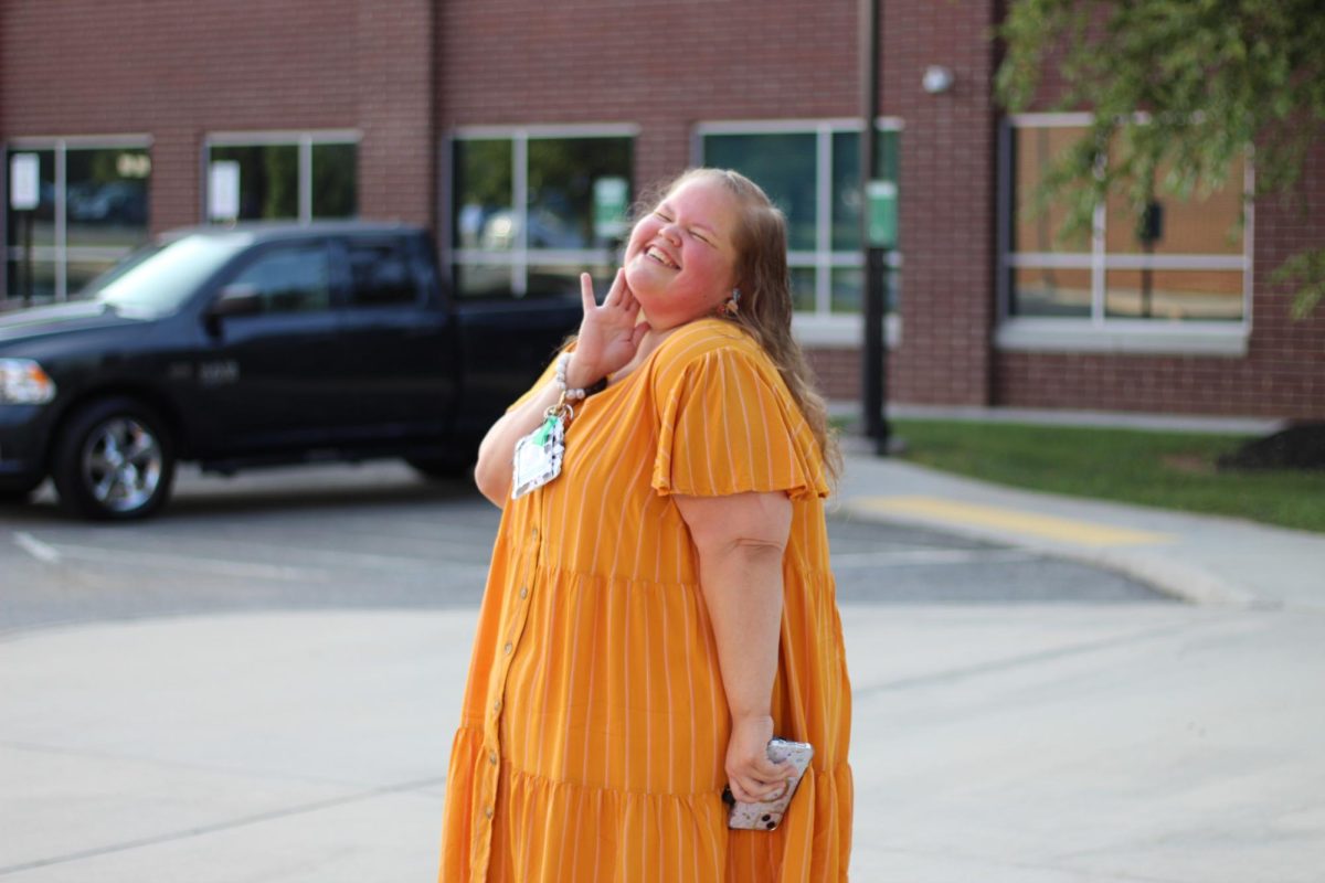 Ms. Guess strikes a pose as she heads out for parking lot duty.