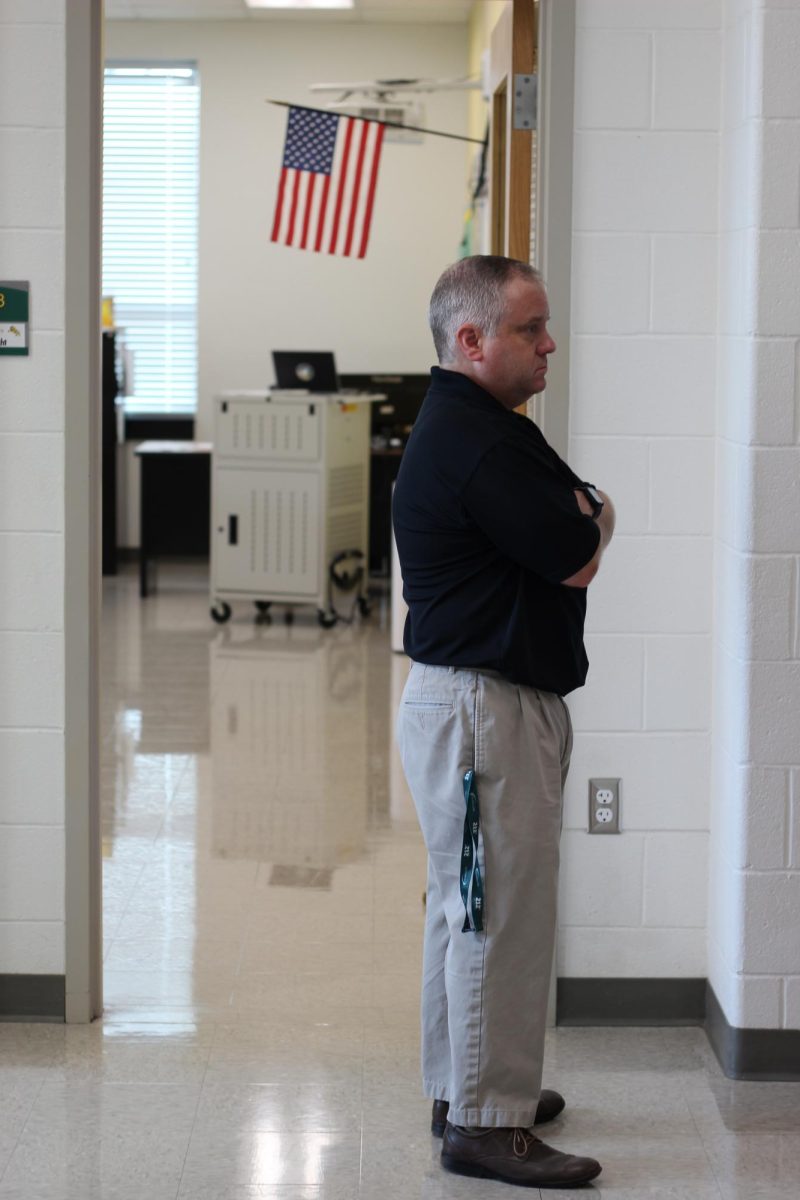 Teachers stand in the halls to help students find their classes or to greet and chat with students after a long summer break.