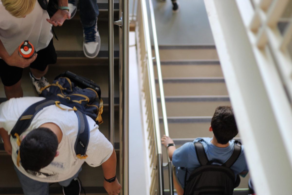 After the final dismissal announcement, students head down three flights of stairs to get to their busses or rides.