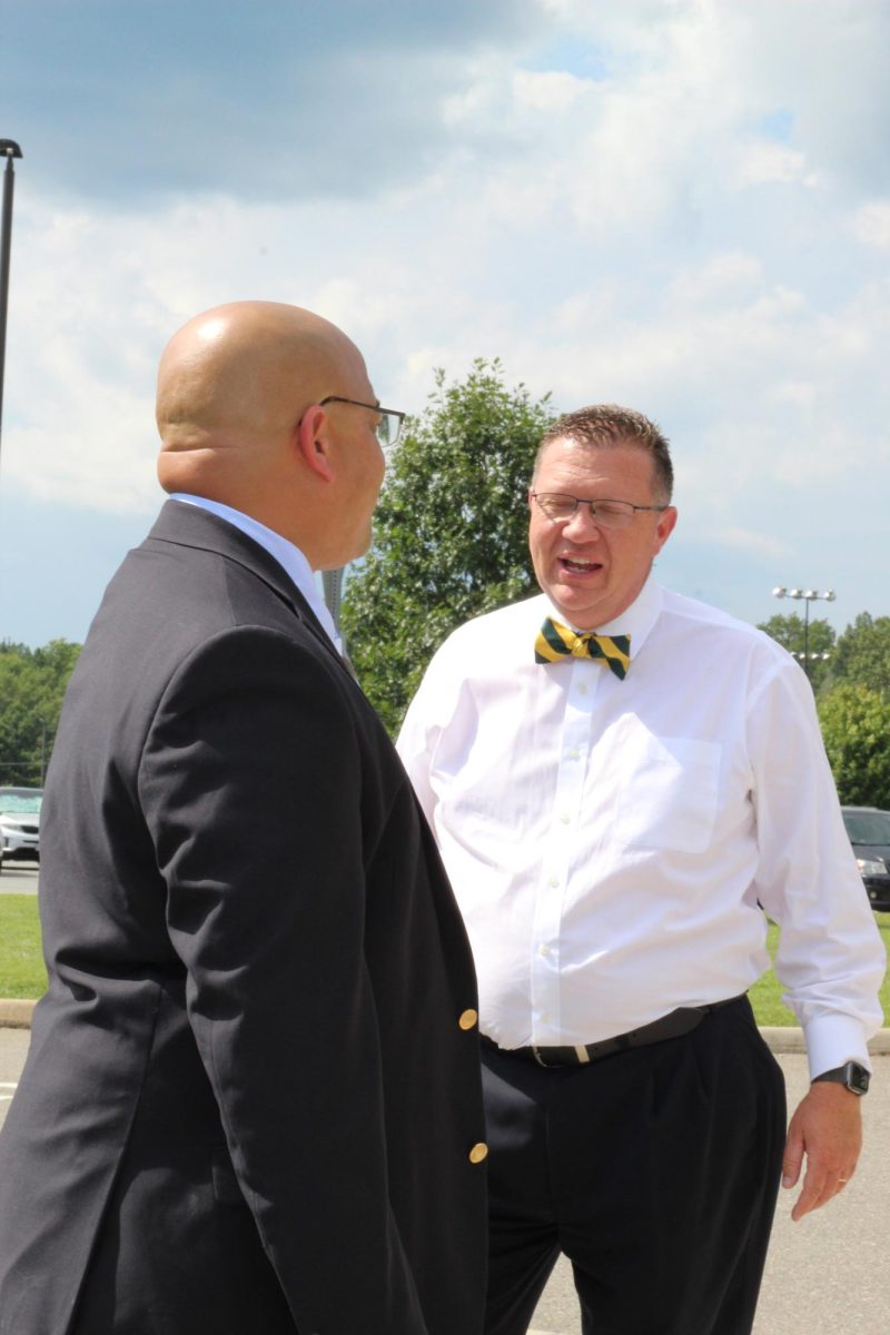 Mr. Redd and Mr. Straley chat about the first day after the busses have left.