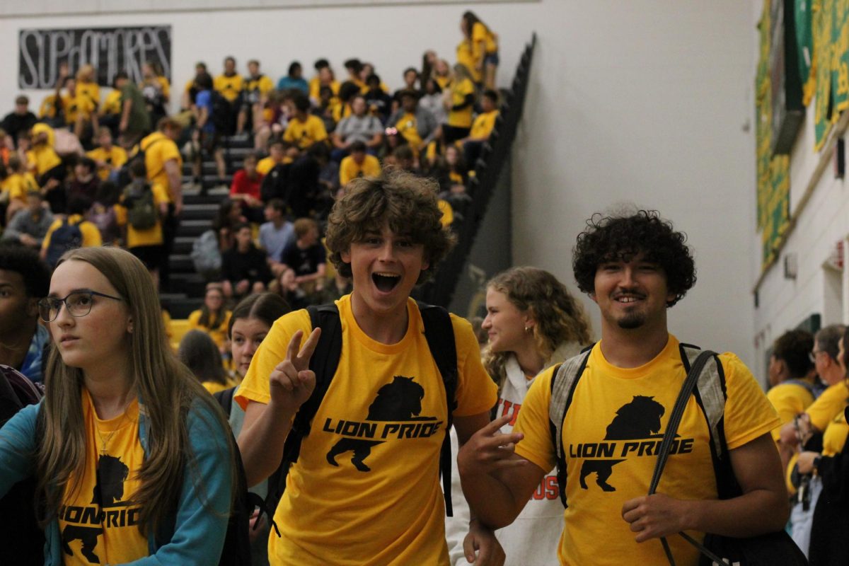 Juniors Larson Moreno and Peyton Pekary excited while joining the gym for the pep-rally.