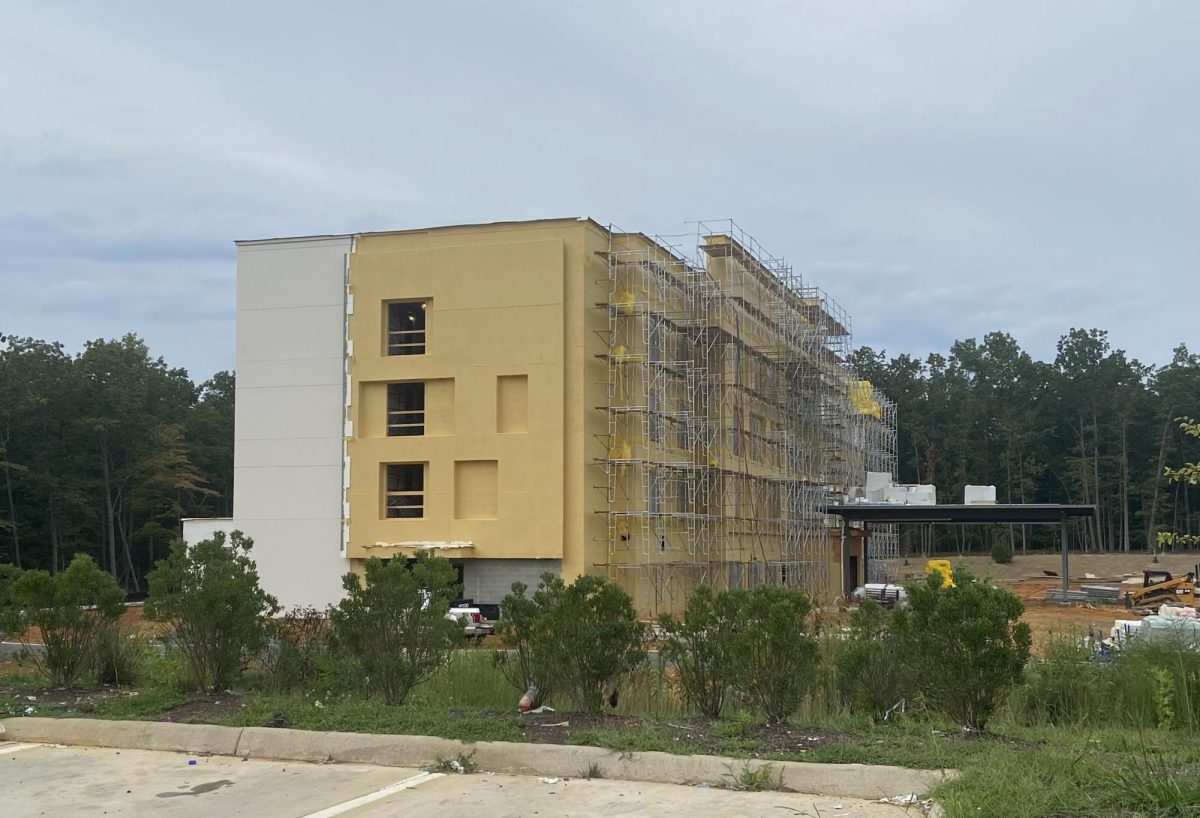 Side view of hotel being built, from 7/11