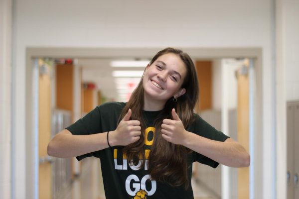 Senior Hannah Ryan plays middle blocker for the Varsity Louisa Lions Volleyball team with a Straley-thumbs-up.