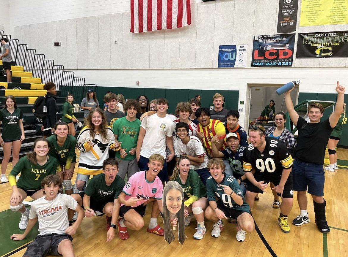 The+varsity+volleyball+teams+student+section+celebrating+together+after+their+win+against+Spotsylvania.