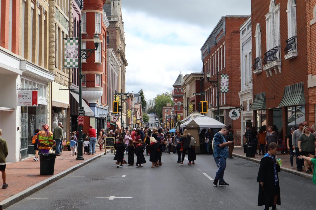 The+streets+of+downtown+Staunton%2C+Virginia+are+flooded+with+participants+dressed+in+Hogwarts+robes+and+other+costumes.
