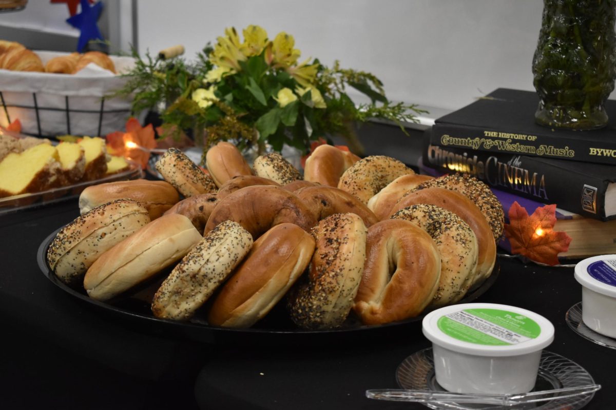 A neatly put together array of bagels sit amongst various sweets at the Promote the Vote event. 