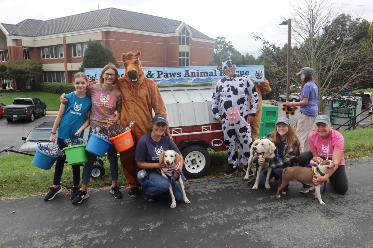 The Hooves and Paws Animal Rescue pose for a photo before the anniversary parade begins.