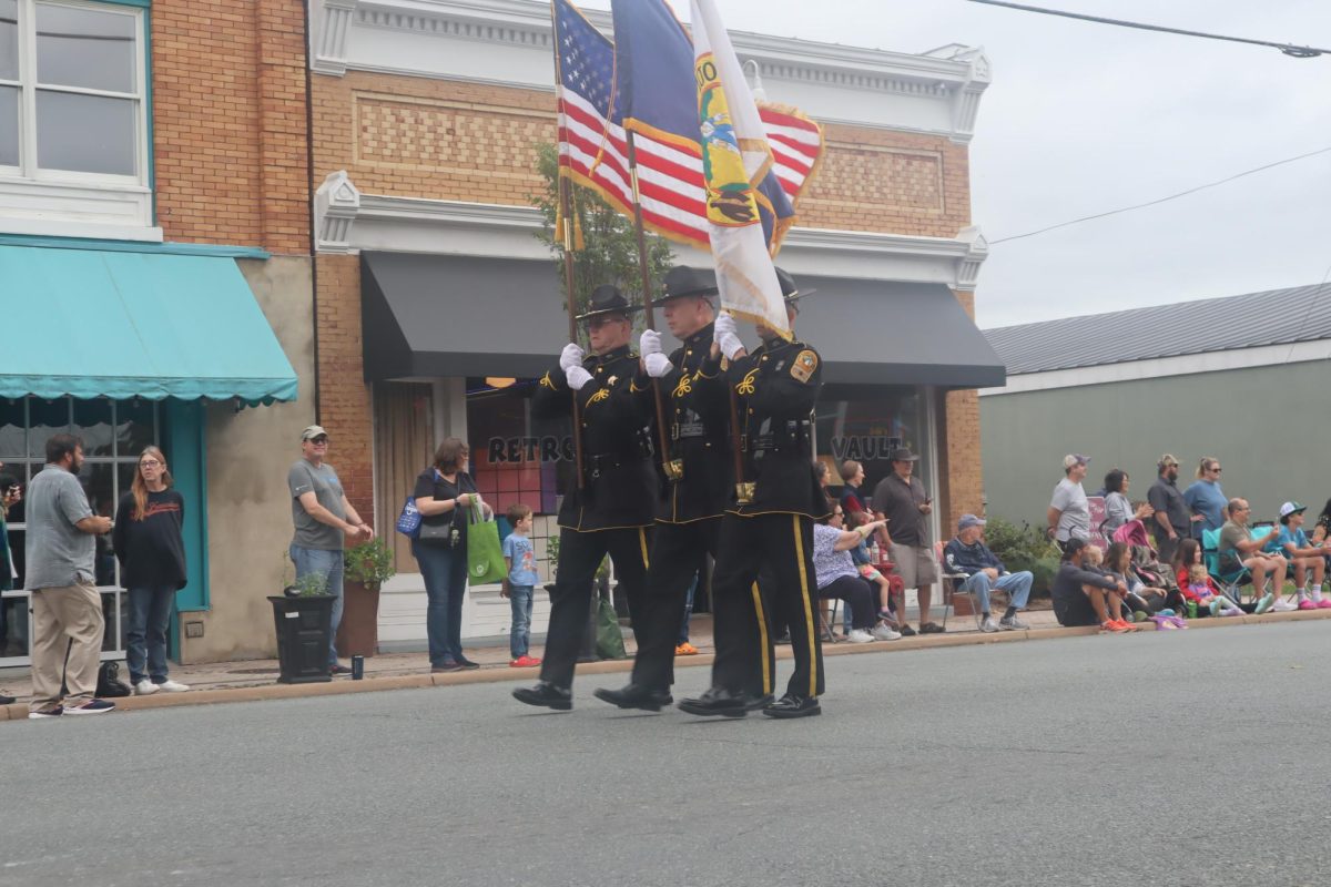 The Sheriffs Office lead the parade while showing off their country, state, and county pride. 