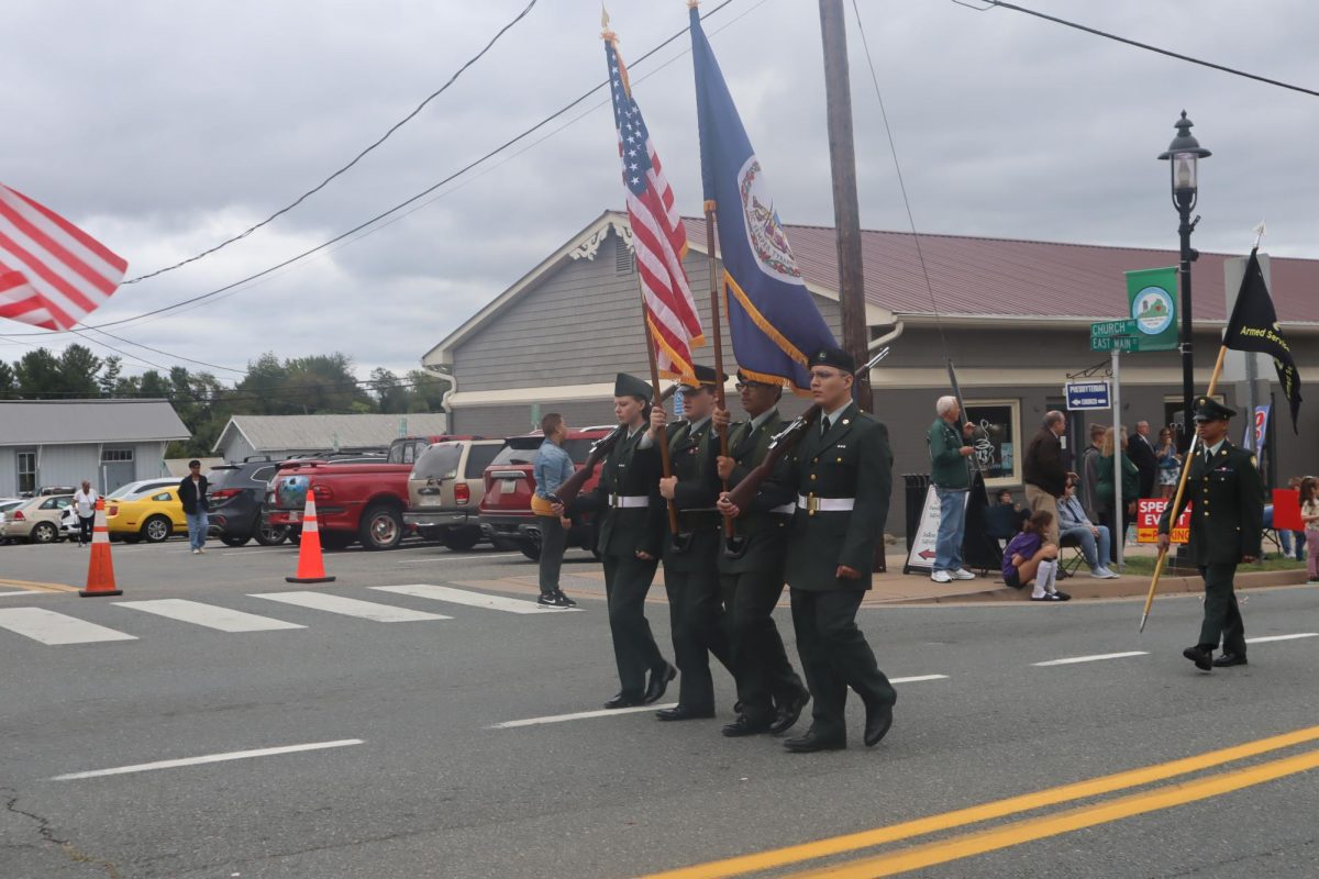 The ROTC walk at attention in unison and help lead the parade on East Main Street. 