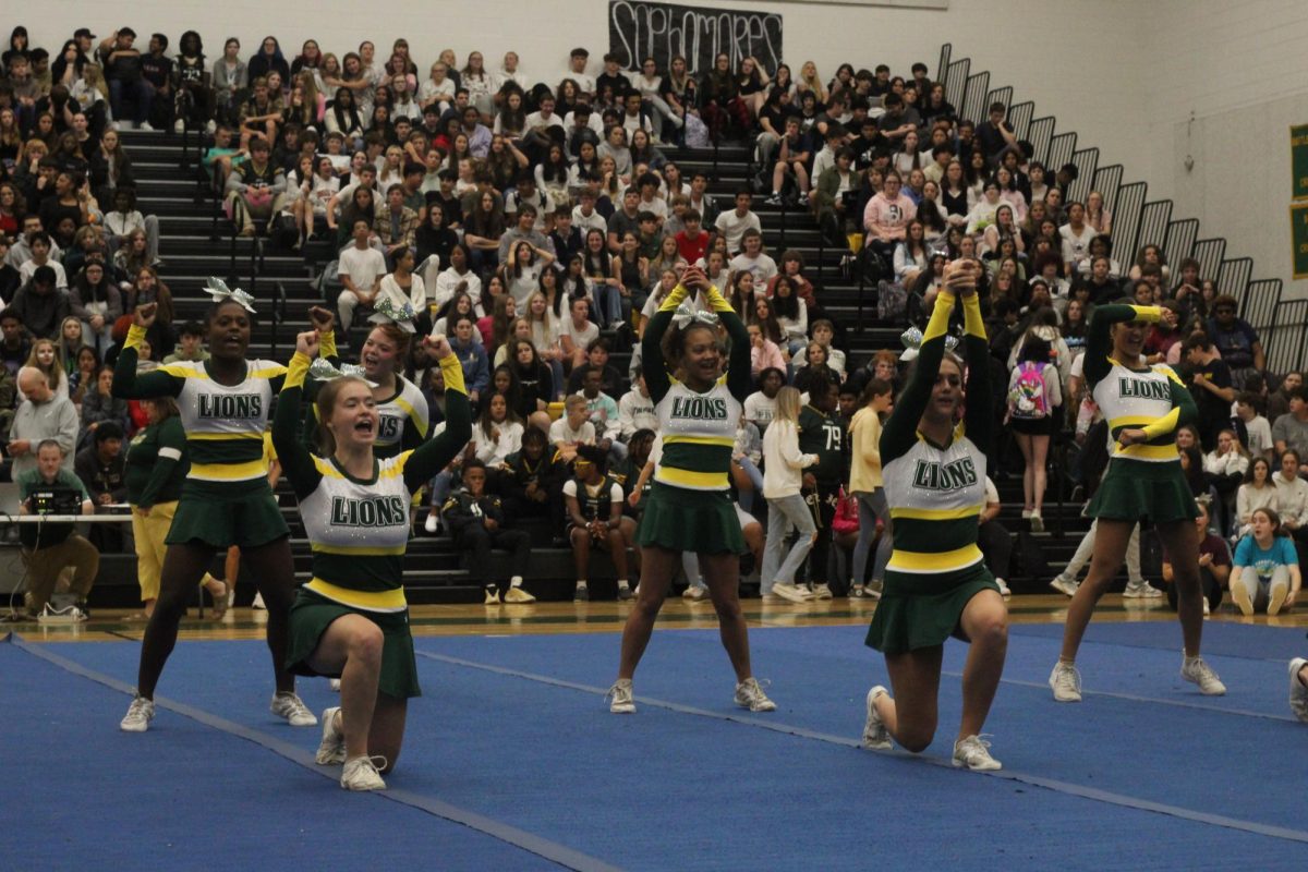 The Competition Cheer team showing off there new moves to the students during the pep-rally.