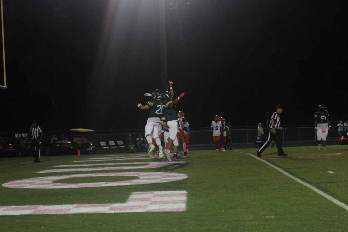 Samuel George celebrating in the air with Jayden Seaberry after his touchdown run.
