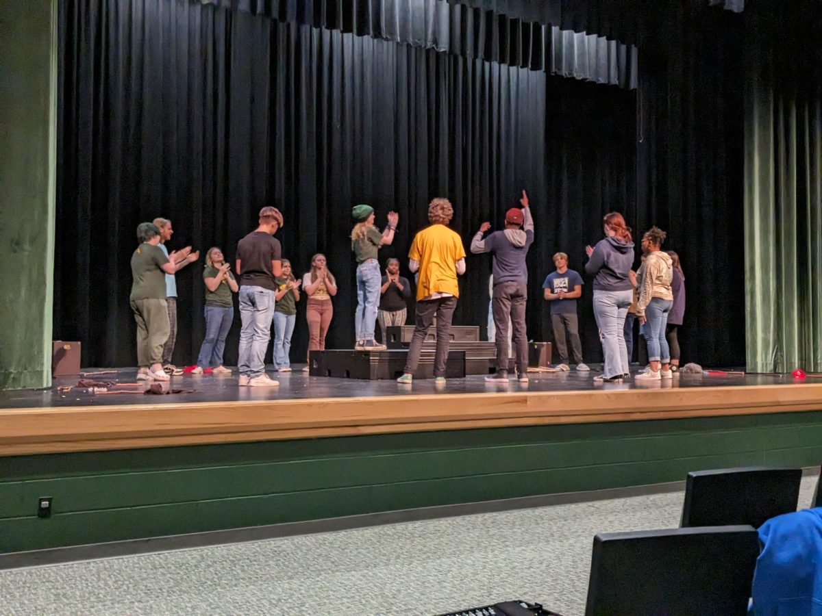 Mainstage students play a game of props where they tell someone in the group something that they like about their performance.