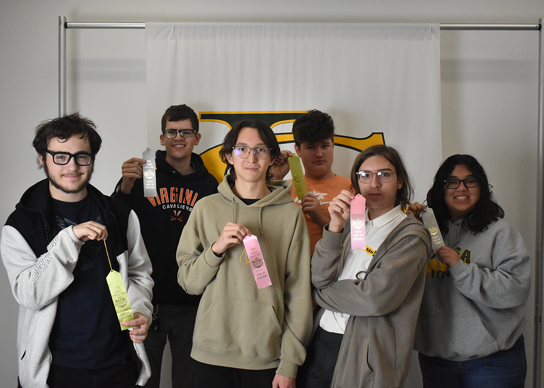 Media class poses for a pic holding up their ribbons. Photo by Jacob Capozella 