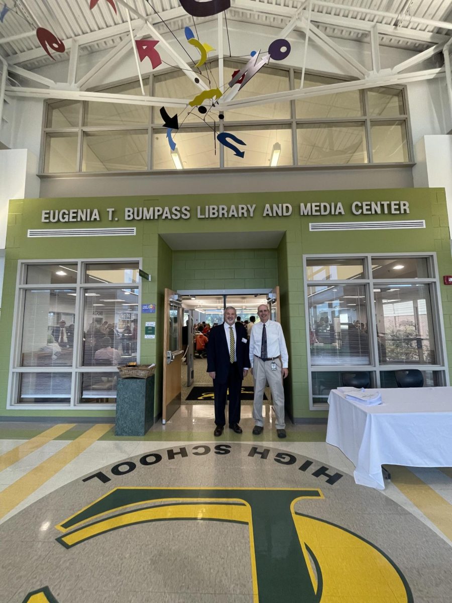 Mark Harris and Greg Strickland stand by the entrance of the Library during an event.