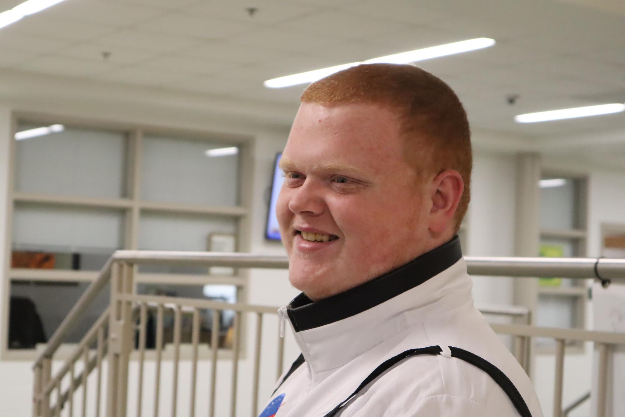 Tristan Wink showing a big smile while being interviewed for a Humans of LCHS