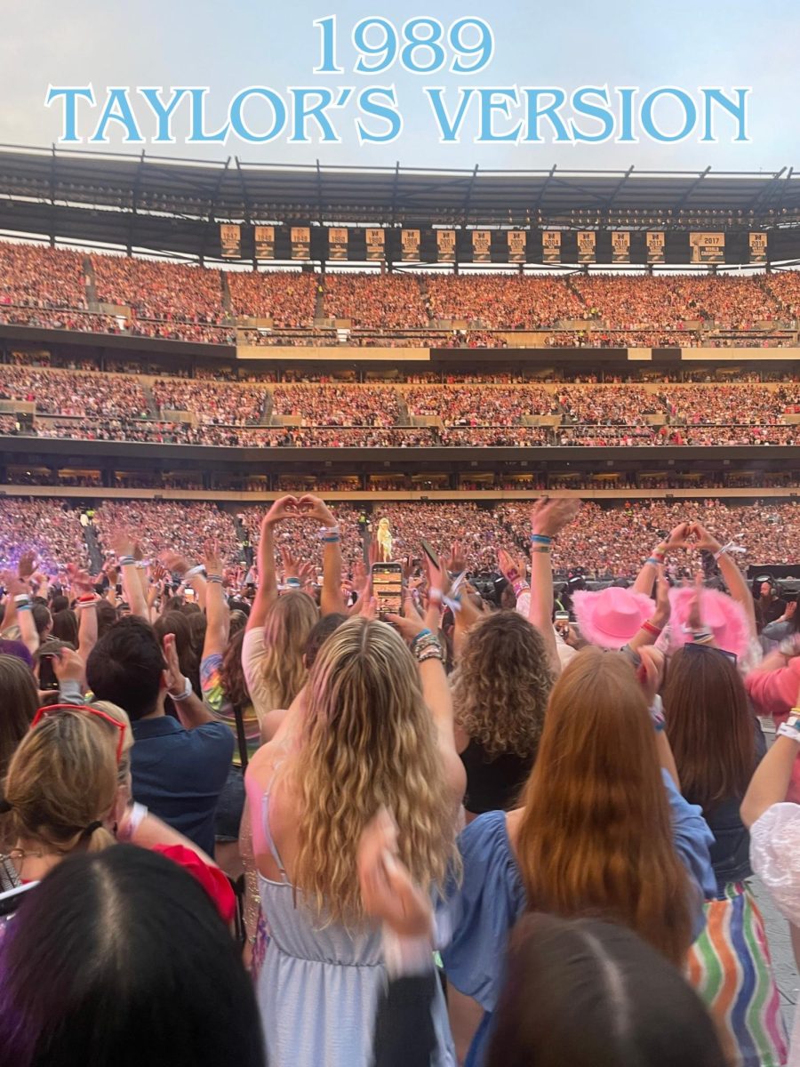 Fans celebrating Swift after she had just made her entrance at the beginning of the Eras Tour.
