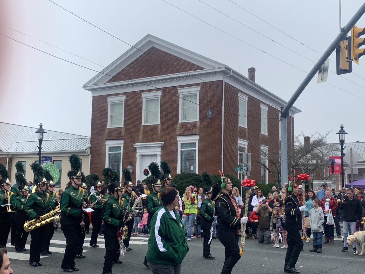 The Louisa Marching Band marching in the town of Louisa during the Christmas parade 