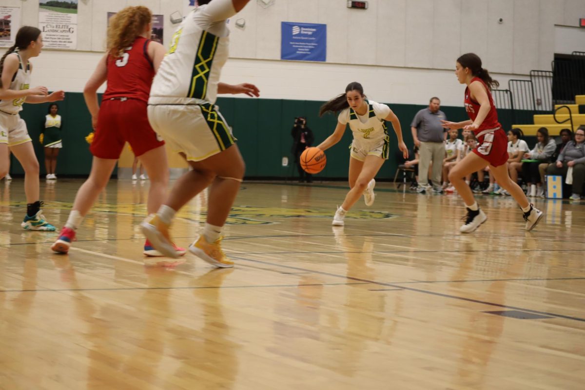 Junior Point Gaurd Taylor Yeatts drives the lane to break down the defence and make a lay up. 