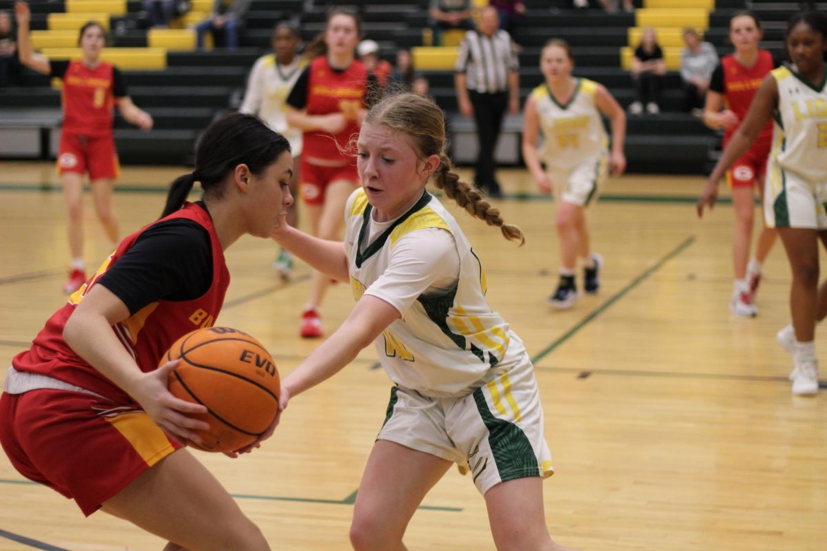 Freshman Point Guard, Katelyn Cheely, playing defense. 