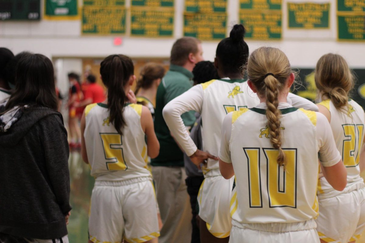 Freshman Katelyn Cheely, Number 10, stands alongside her teammates during halftime. 