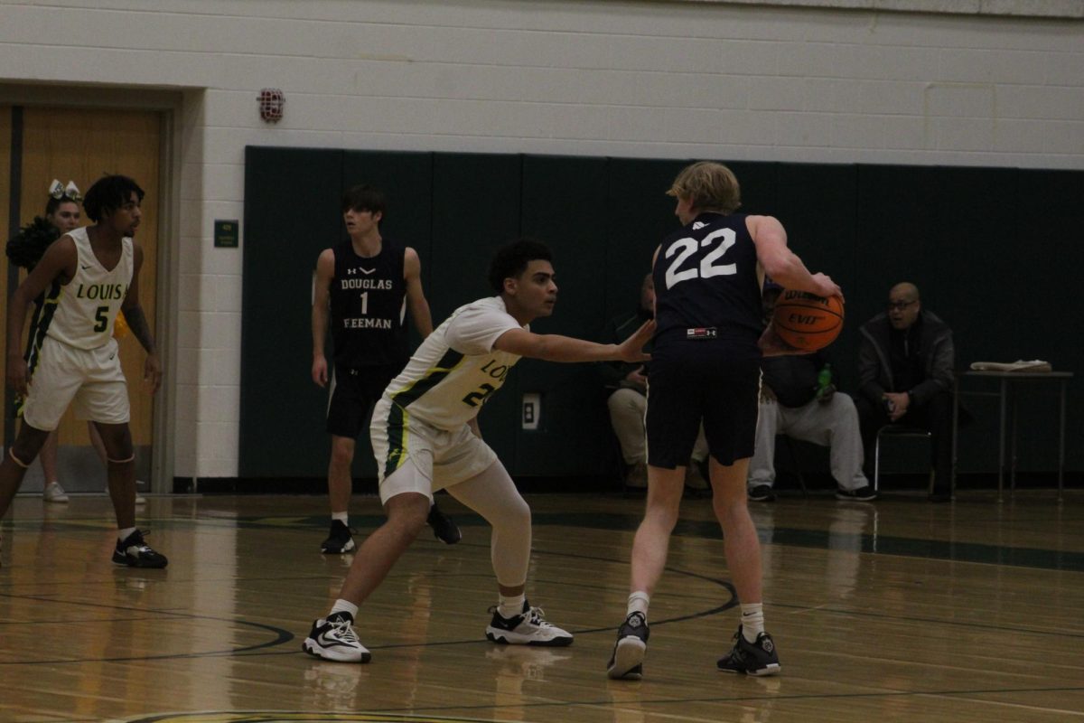Sophomore forward Eric Davis  playing pressure defense on the ball. 