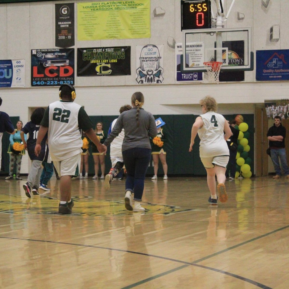 Allyson Rigsby guiding ORondae Askew down the court to help the defense. 