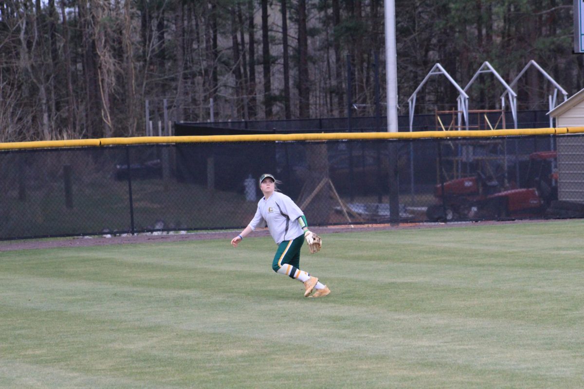 Right Fielder Addison Smith preparing to catch a ball during warmups. 