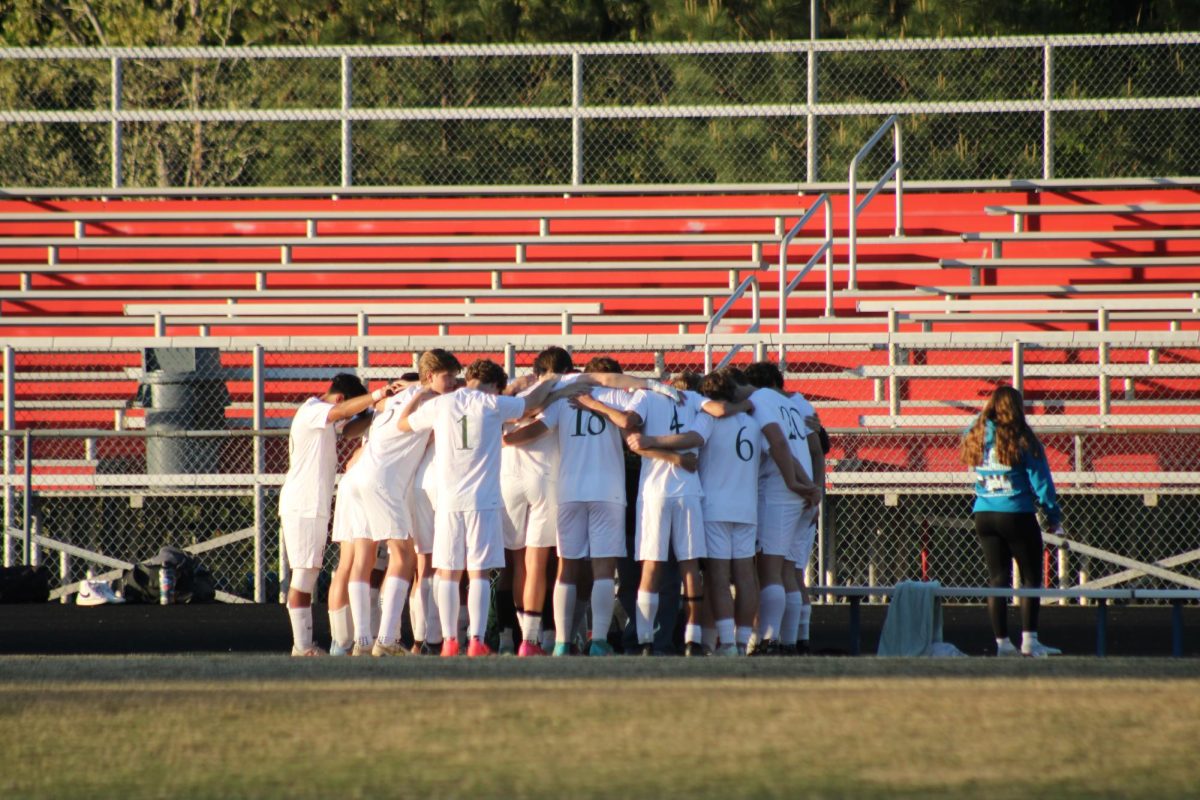 Before the game begins Louisa players huddle up to motivate each other and pray.