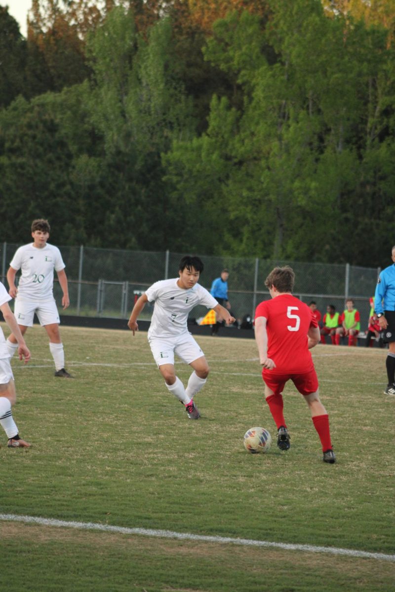 #7 Paul Archer defending Goochland player from advancing up the field.