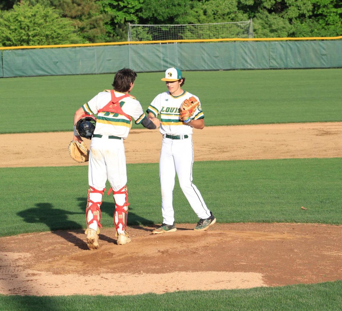 Catcher and Pitcher duo Cody Fifer and Cole Loudin shaking hands before the game. 