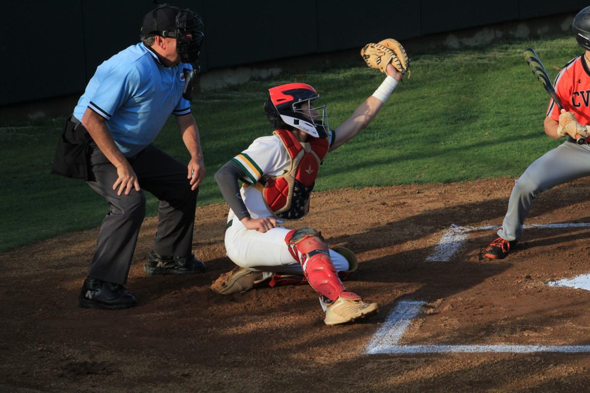 Senior Cody Fifer attempts to frame the ball and get a catchers strike. 