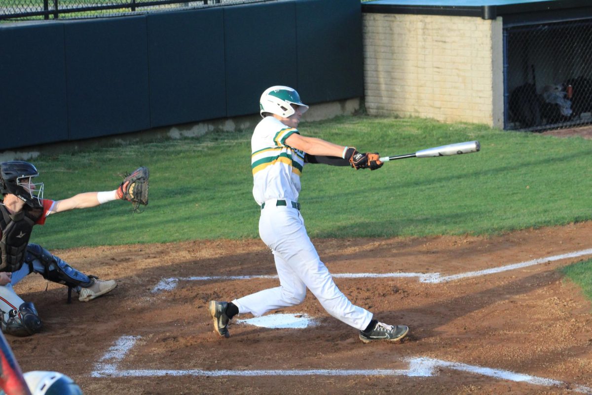 Senior Connor Downey stays level when swinging hard at a pitch 