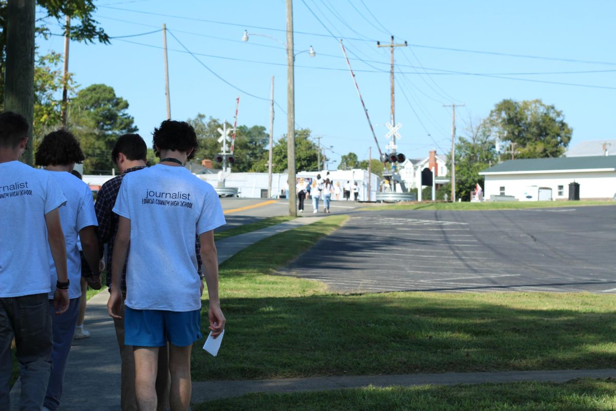 Staffers begin their walk to interview local businesses around Louisa.